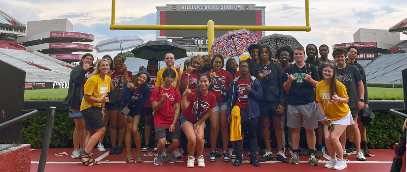 Summer JAM participants pose in front of the uprights at Williams-Brice Stadium