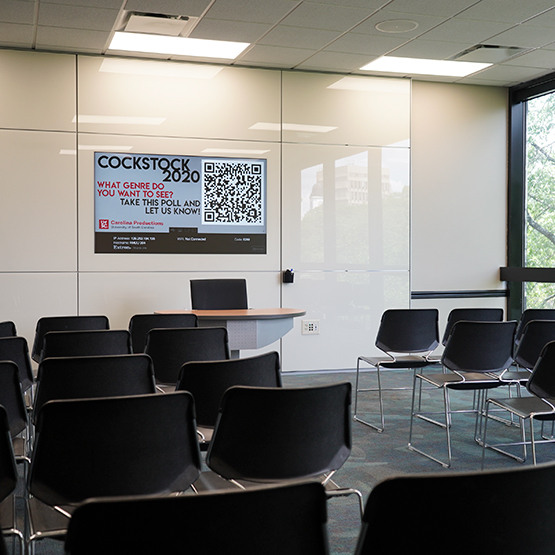 chairs set up for a meeting in the room