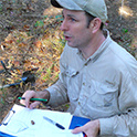 archeologist recording data
