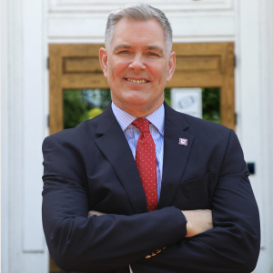 Tom Reichert standing in front of Davis College