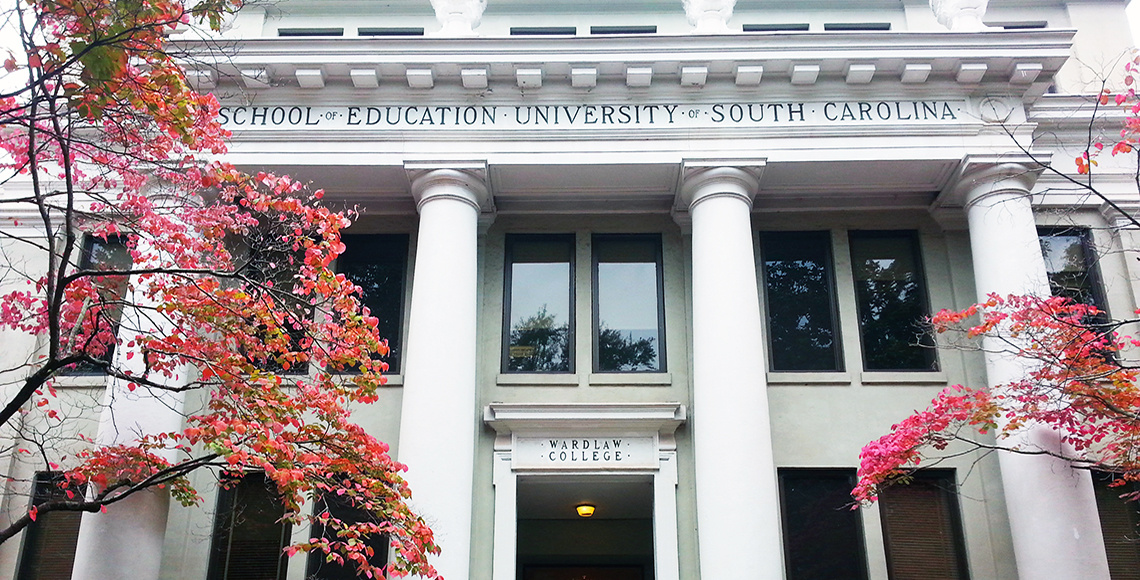 Wardlaw College. Pink flowering trees are visible