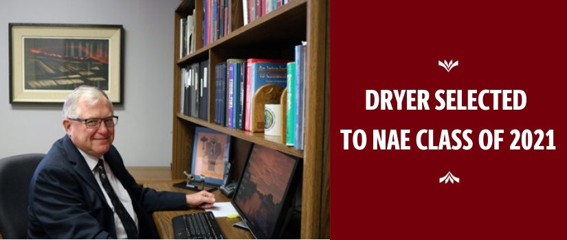 Fred Dryer sits at his desk in the Swearingen building.