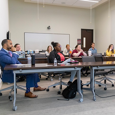 Teachers in classroom listening to speaker