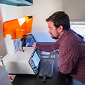 Scientist using a bioprinter