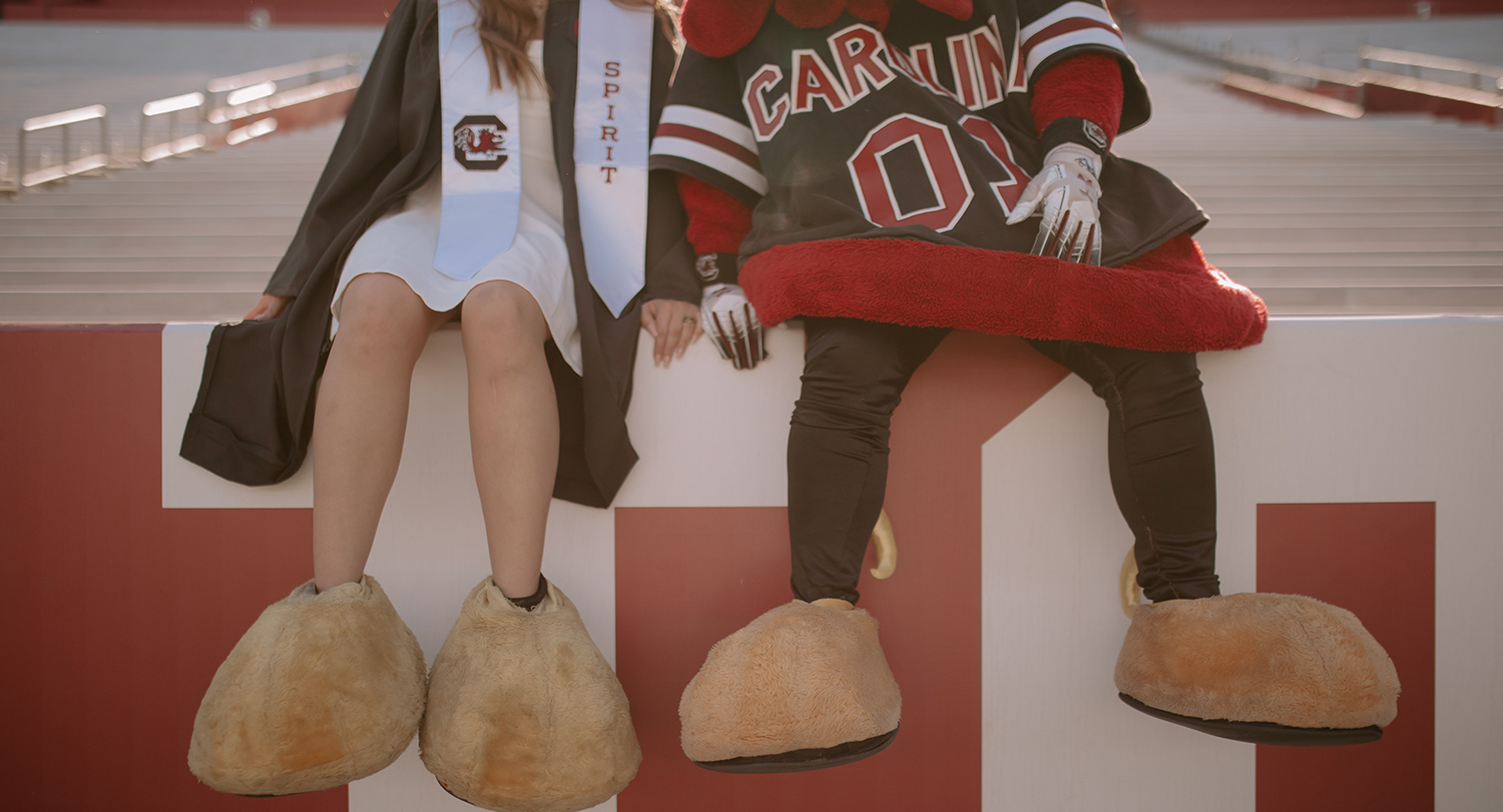 Sarah and Cocky sitting at Willams Brice Stadium