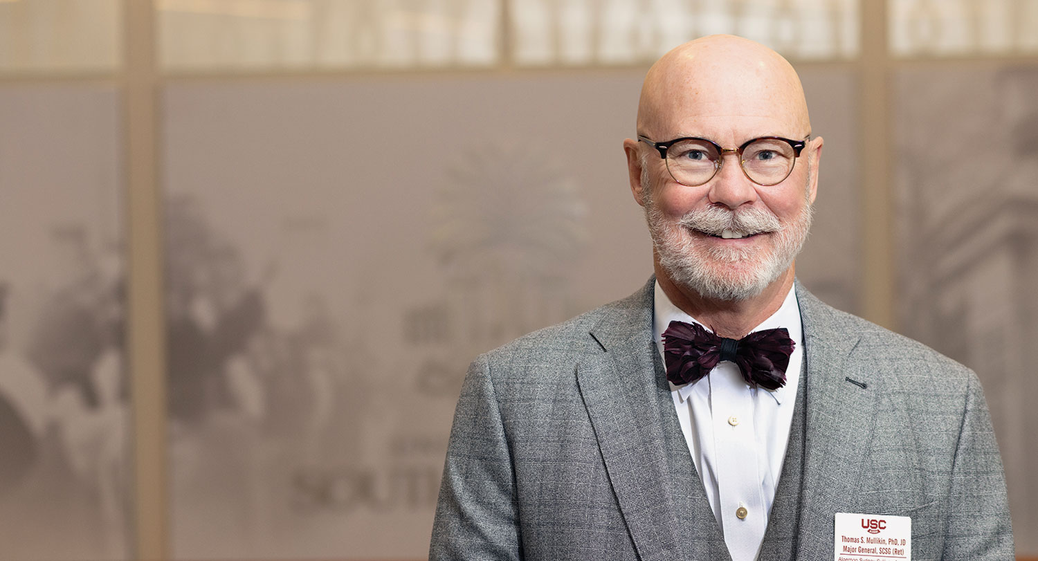Tom Mullikin smiles for the camera in a bowtie.