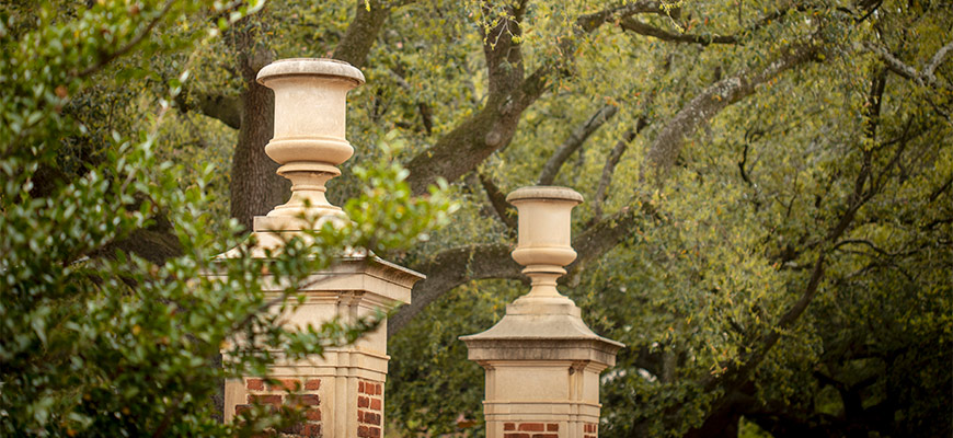 brick gates with large urns on top