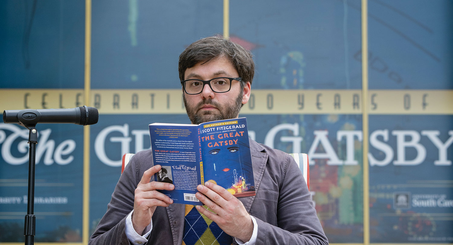Michael Weisenburg, director of the Irvin Department of Rare Books and Special Collections reads from “The Great Gatsby” outside of Thomas-Cooper Library.
