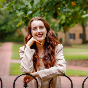 Ella Tocci leaning on a gate in the Horseshoe. 