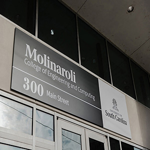 Signage of the Molinaroli College of Engineering and Computing's building at 300 Main