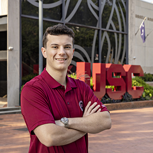 Headshot of Cole Rotondo in front of the Russell House