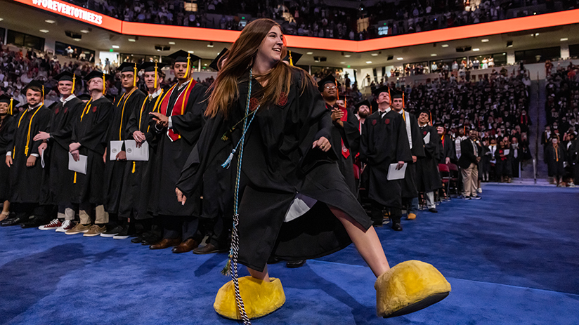 Sarah wearing the Cocky feet at graduation and running around to 2001.