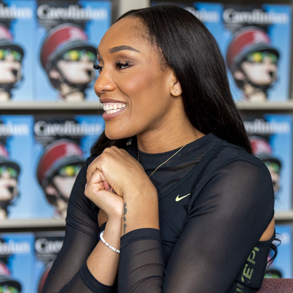 Aja Wilson with her hands clasped during an interview.